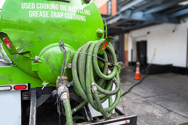 pumping out a heavy-duty grease trap at a restaurant in Bart